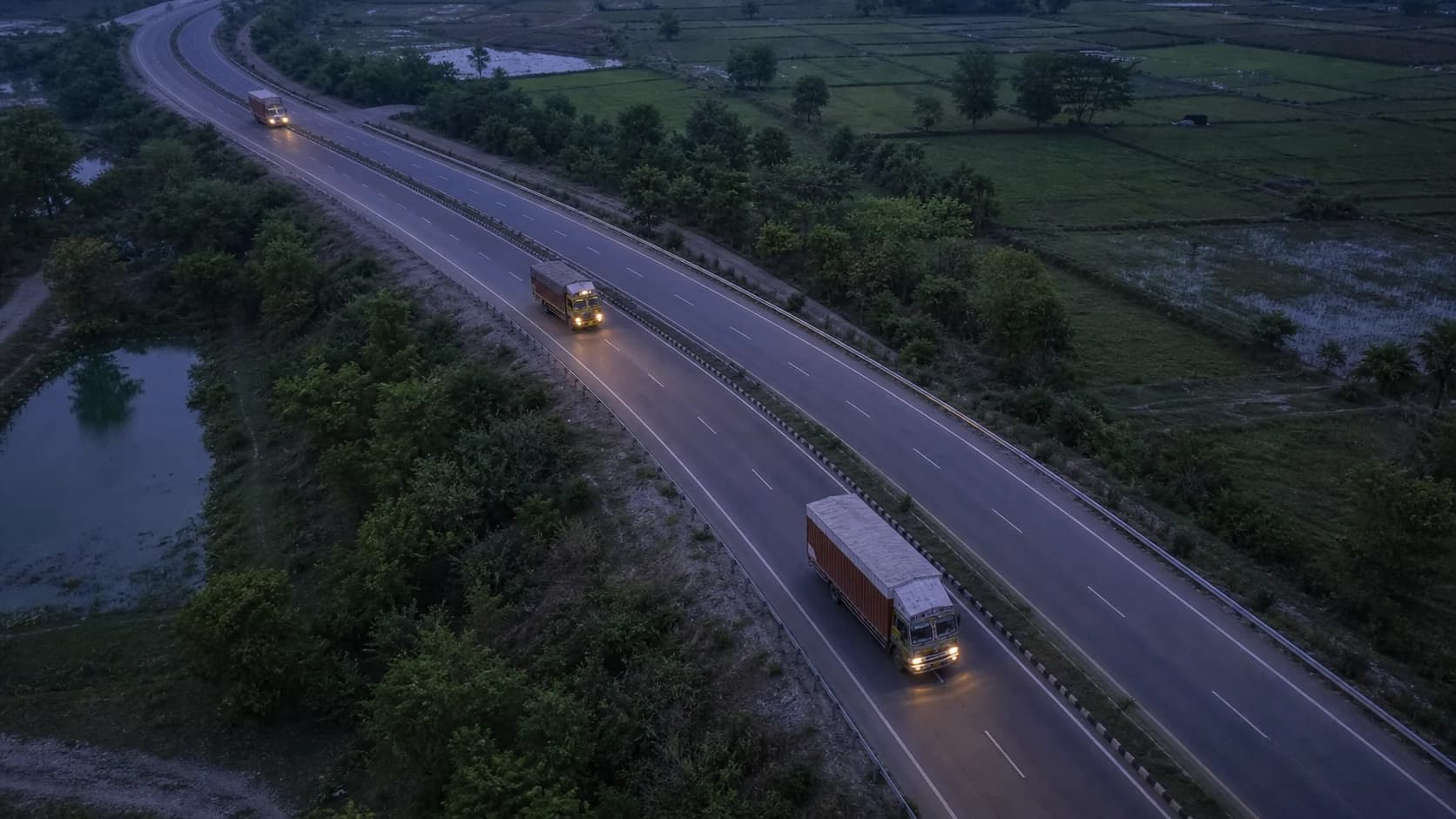 Commercial trucks travelling on a Bihar highway